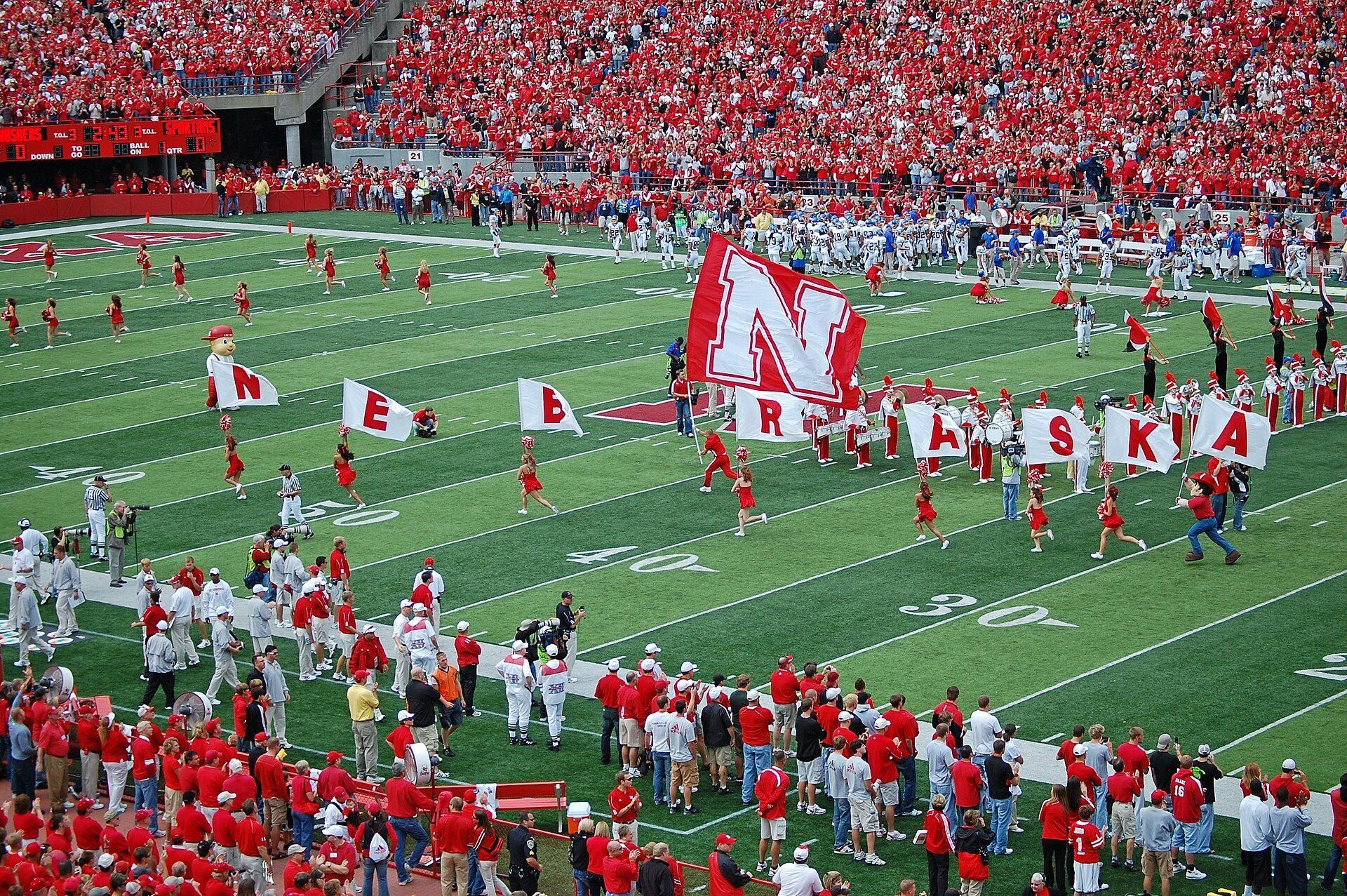 Red flags fly over the stadium before a Nebraska football game. A Wikimedia Commons photograph on Brent O'Mara Insights.