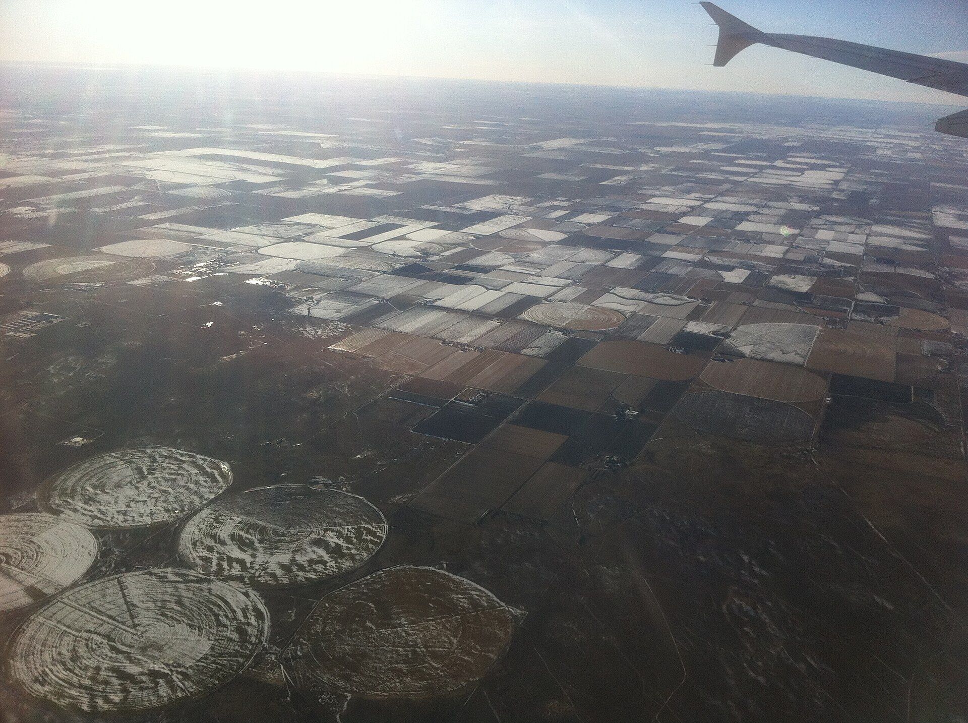 Circular irrigated fields in Nebraska seen from the air. A Wikimedia Commons photograph on Brent O'Mara Insights.