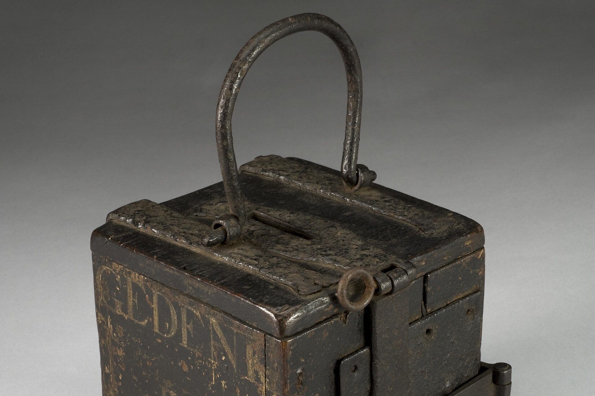A carved wooden alms box of the seventeenth or eighteenth century with a slot for coins. A Wikimedia Commons photograph on Brent O'Mara Insights.