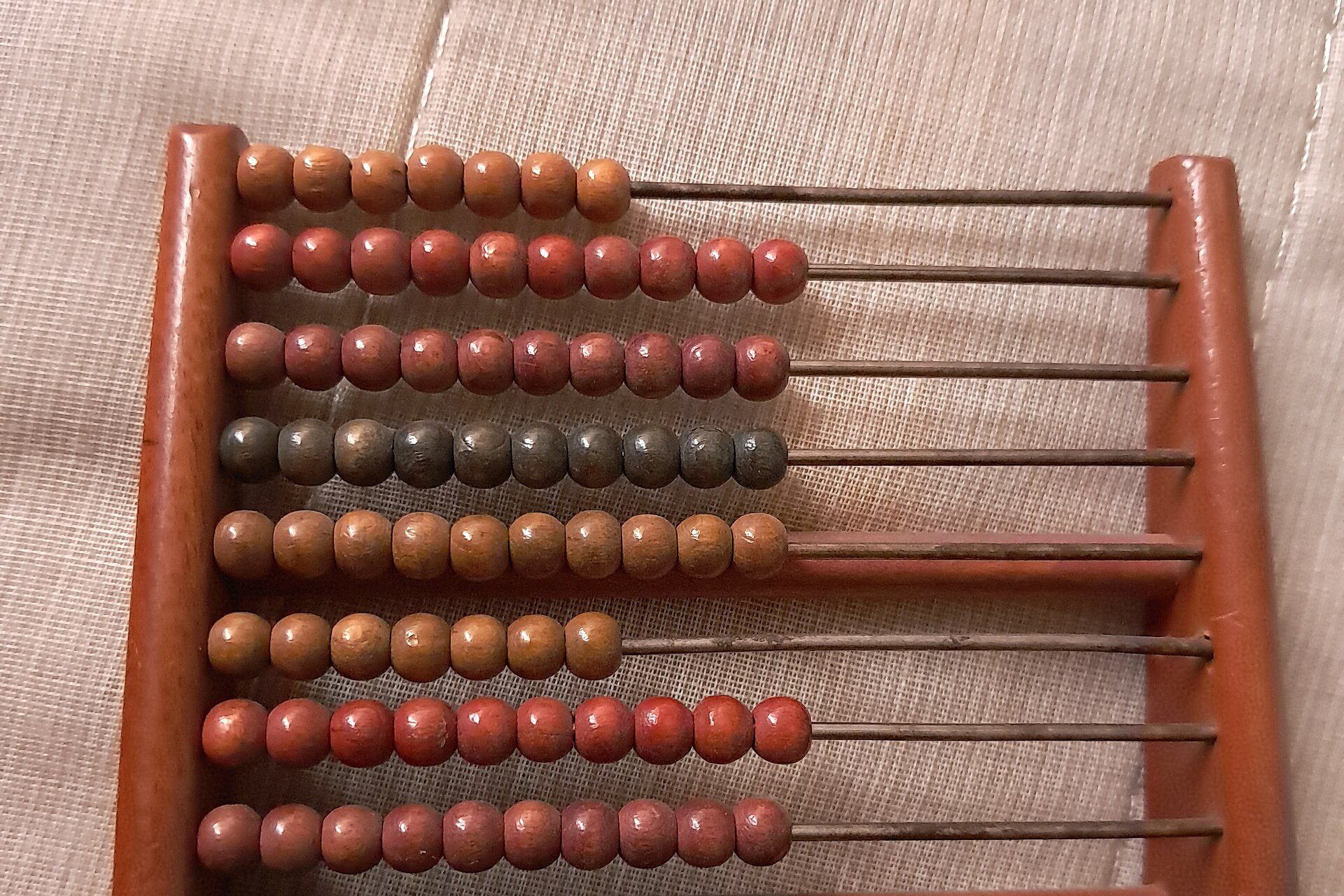 A small wooden abacus with its beads. A Wikimedia Commons photograph on Brent O'Mara Insights.