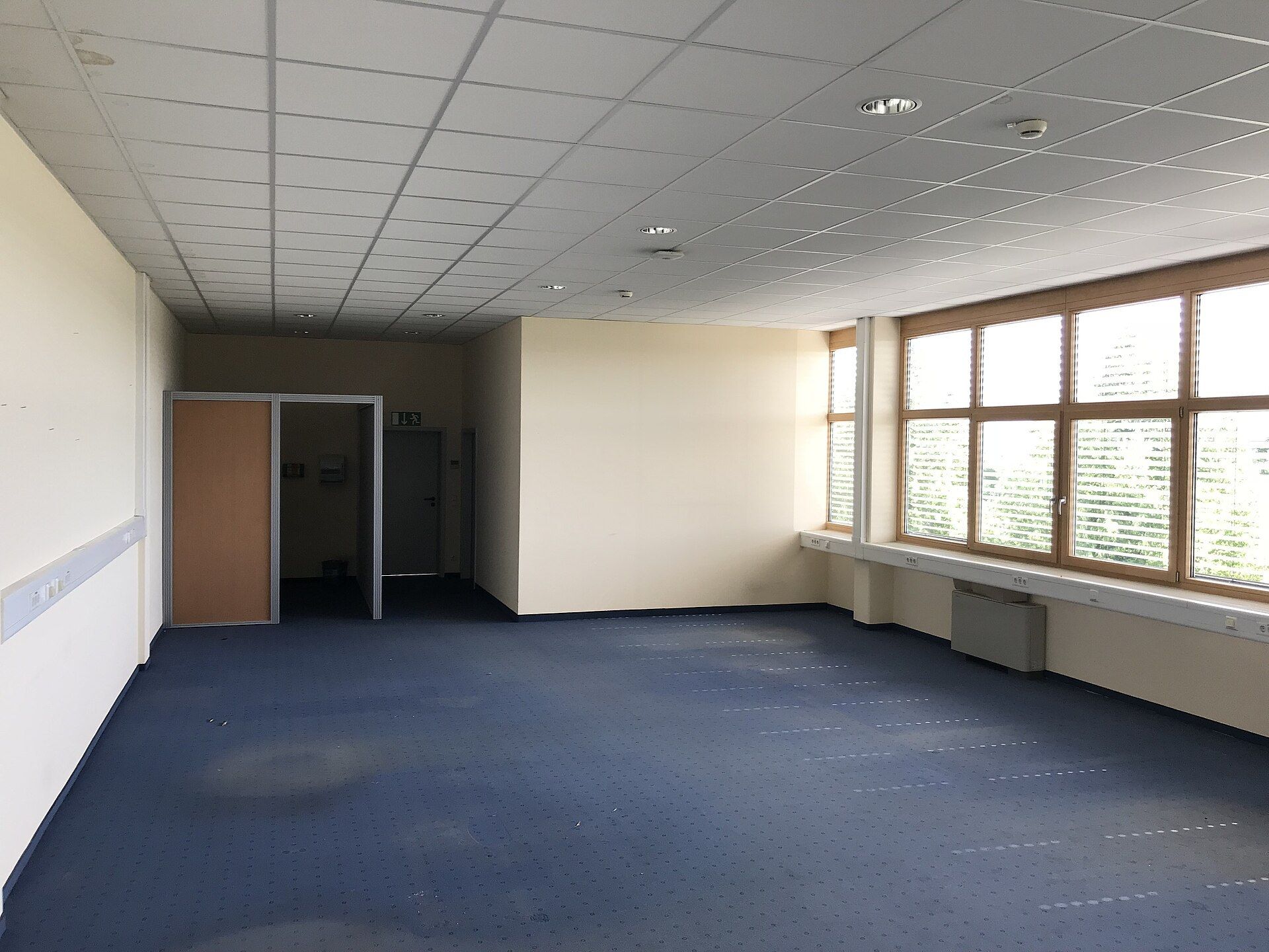 An empty office room with windows and bare floor. A Wikimedia Commons photograph on Brent O'Mara Insights.