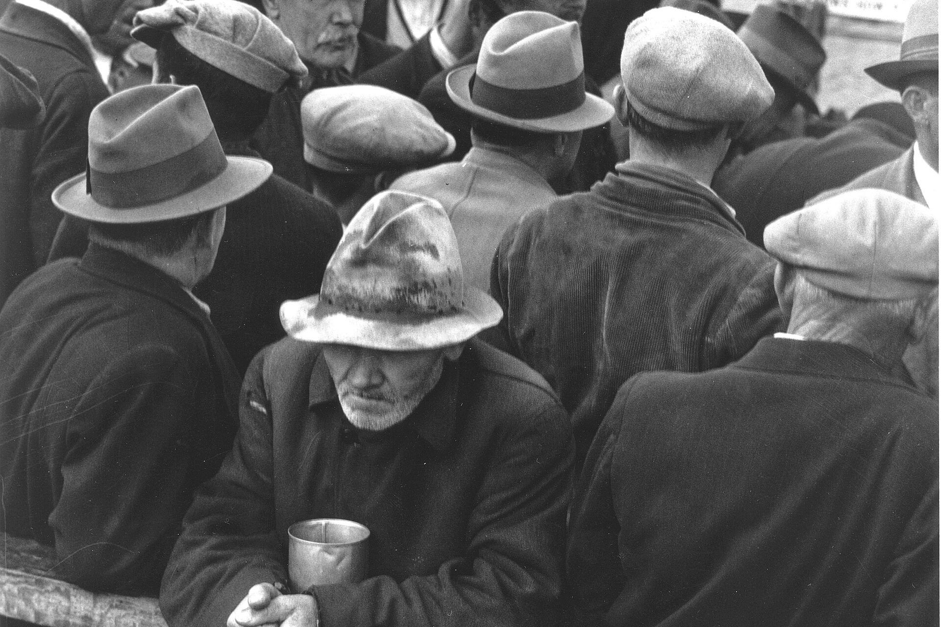 Men wait in a breadline in San Francisco in 1932. A Wikimedia Commons photograph on Brent O'Mara Insights.