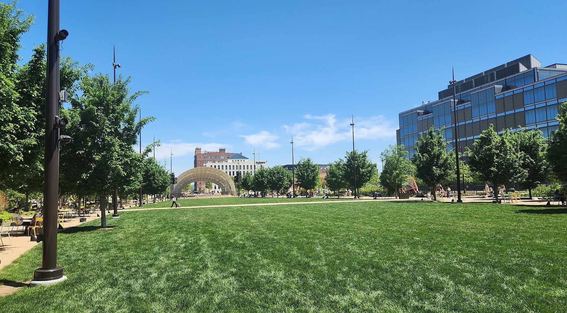 The lawns and water of Gene Leahy Mall with the Omaha skyline behind. A Wikimedia Commons photograph on Brent O'Mara Insights.
