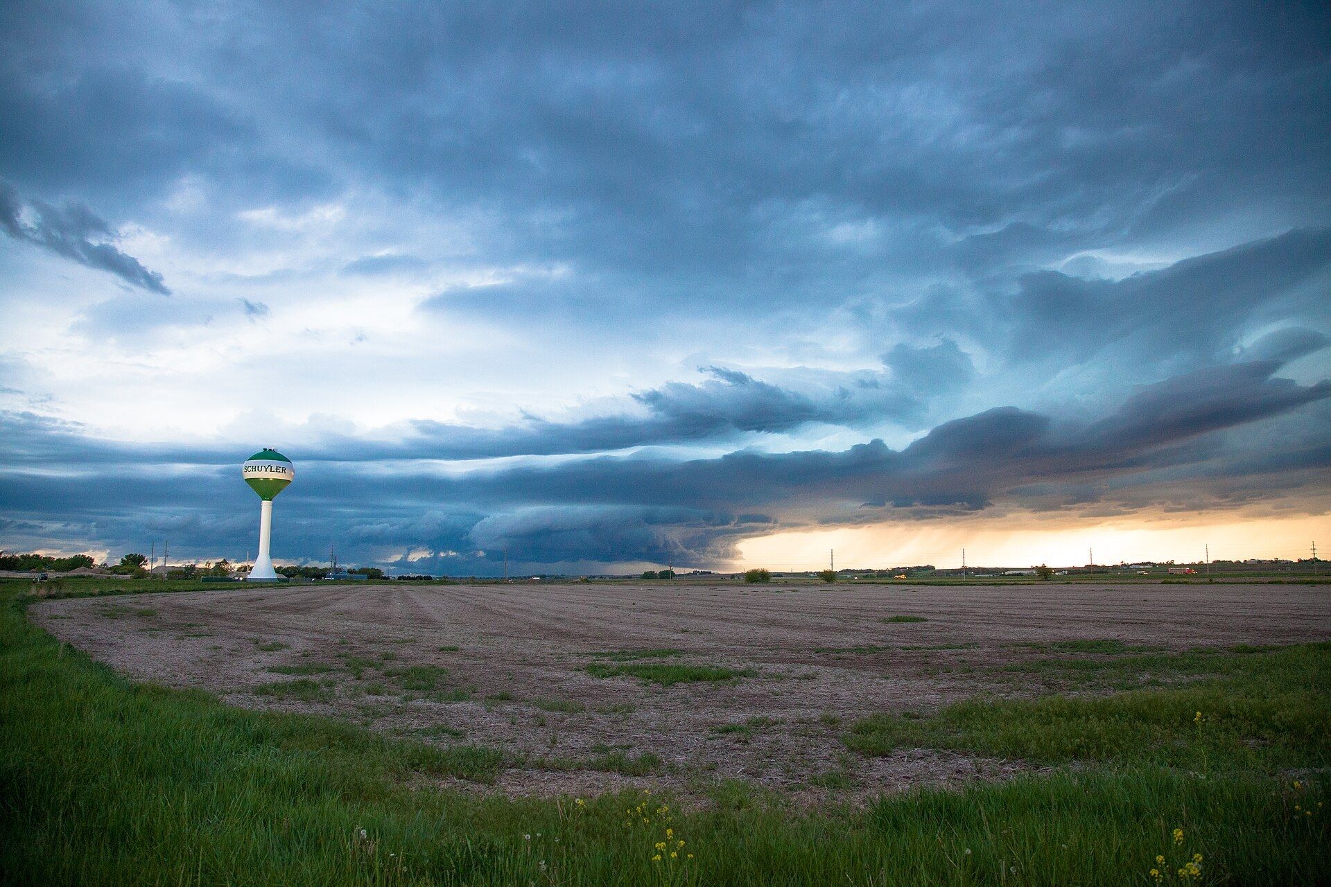 Storm clouds break over farmland near Schuyler Nebraska at sunset. A Wikimedia Commons photograph on Brent O'Mara Insights.
