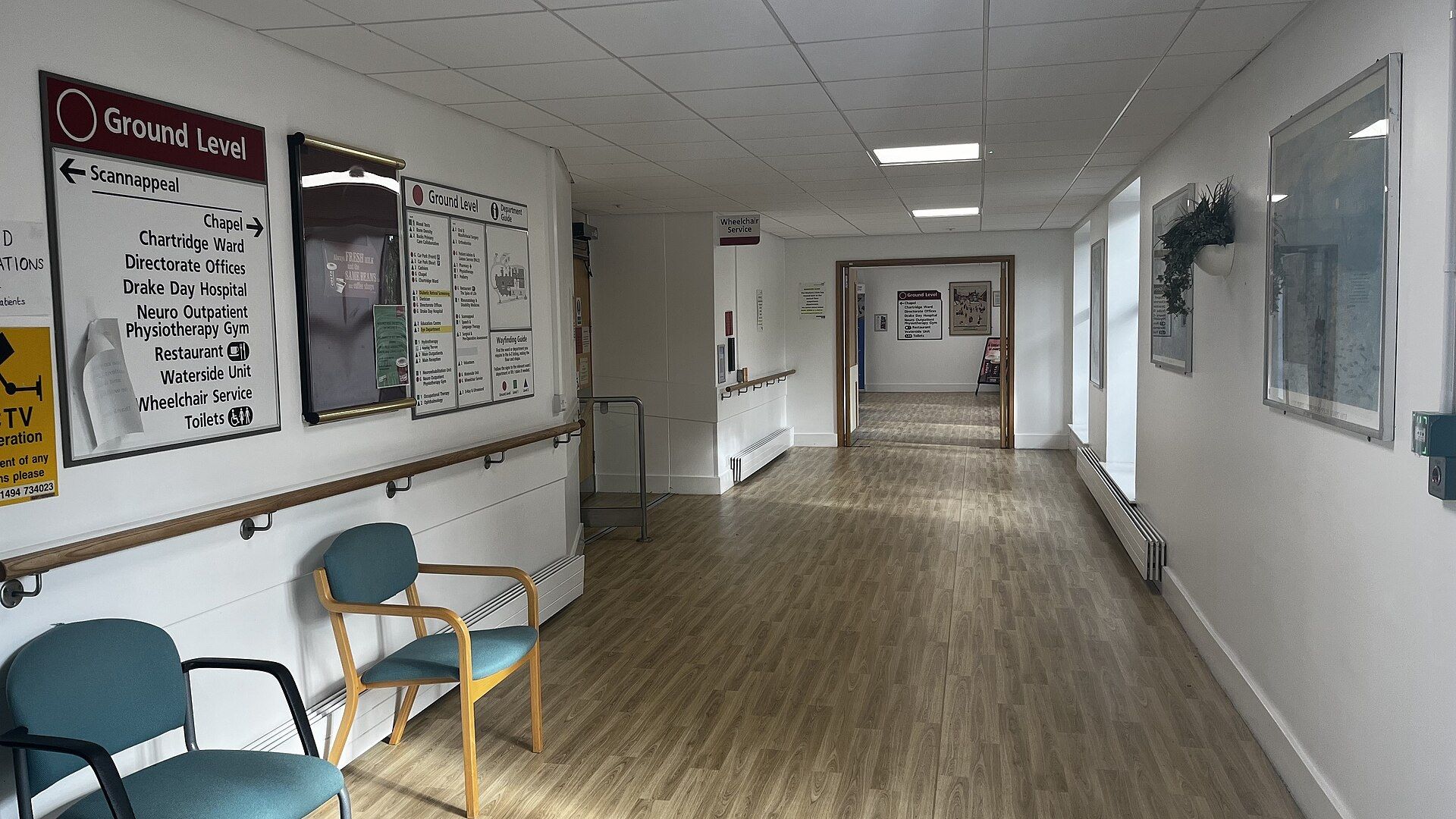 An empty hospital corridor with doors along one side. A Wikimedia Commons photograph on Brent O'Mara Insights.