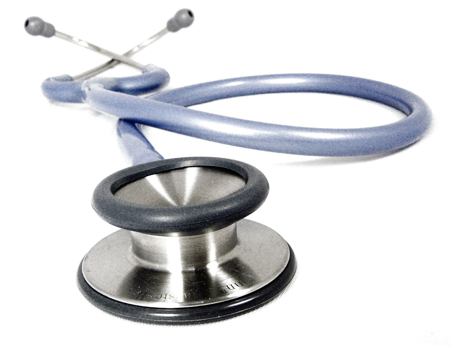 A doctor's stethoscope coiled on a white surface. A Wikimedia Commons photograph on Brent O'Mara Insights.