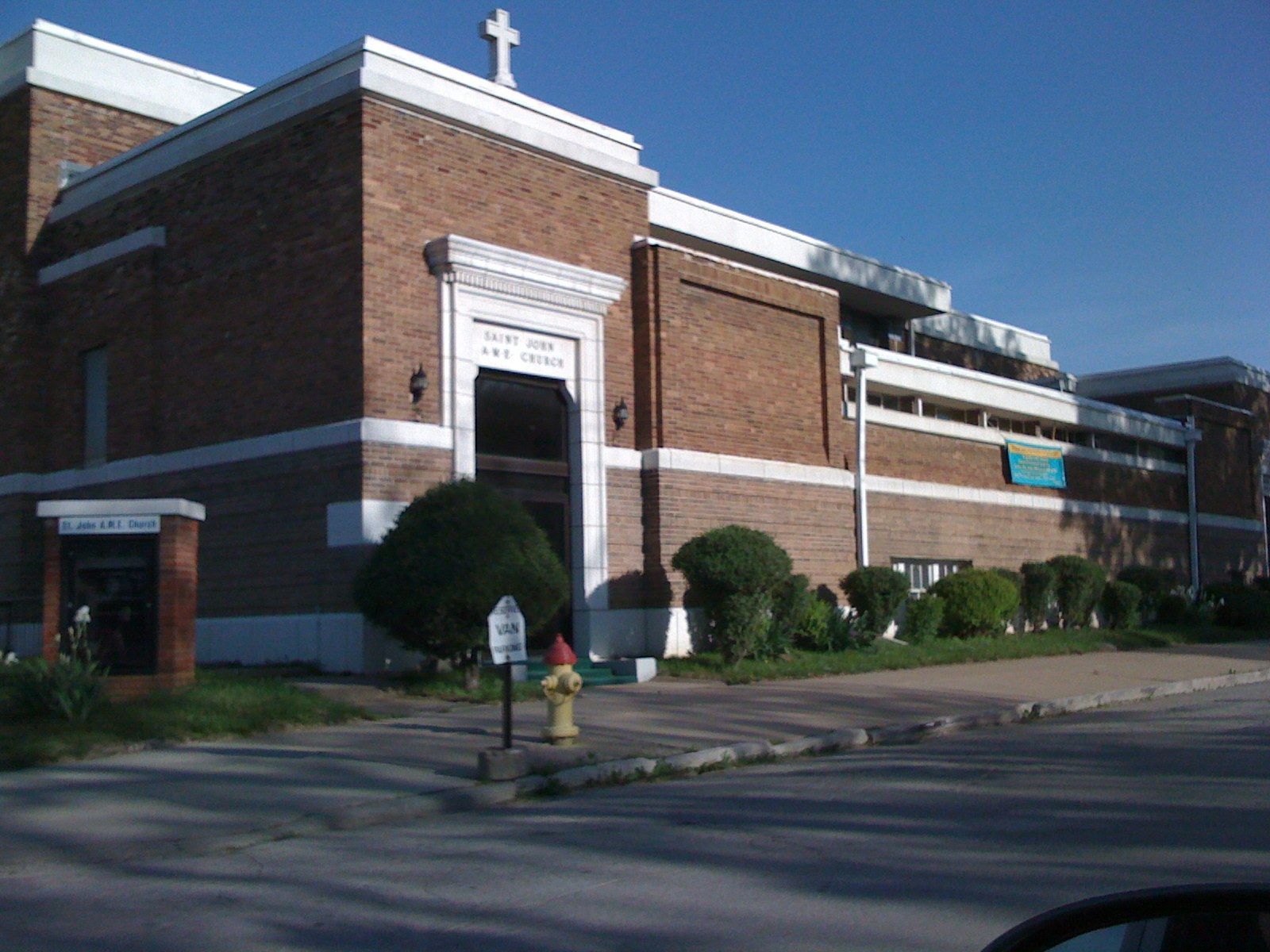A brick church with a tall tower on a street corner in Omaha. A Wikimedia Commons photograph on Brent O'Mara Insights.