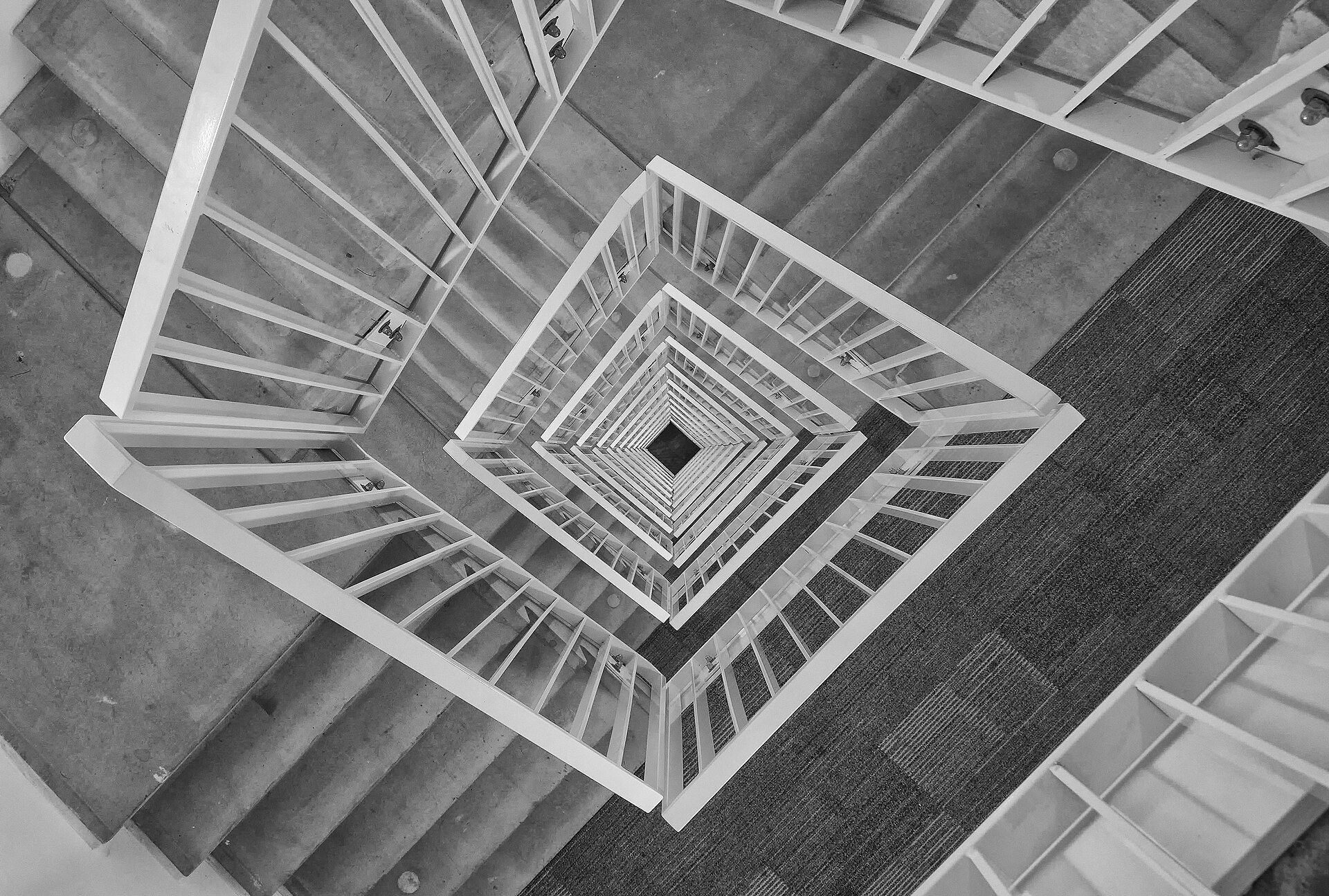 A stairwell in a high rise seen from above as it descends floor by floor. A Wikimedia Commons photograph on Brent O'Mara Insights.