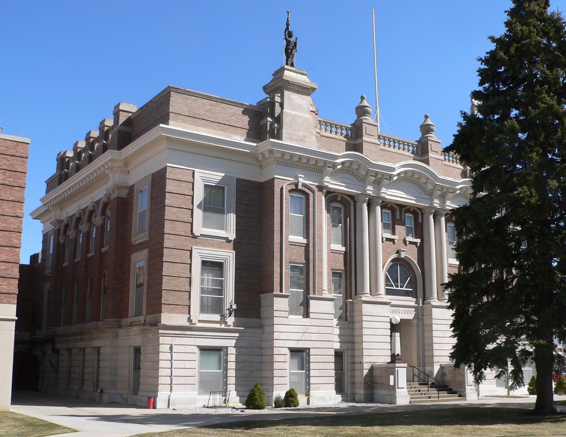 The county courthouse in Lexington Nebraska under a clear sky. A Wikimedia Commons photograph on Brent O'Mara Insights.
