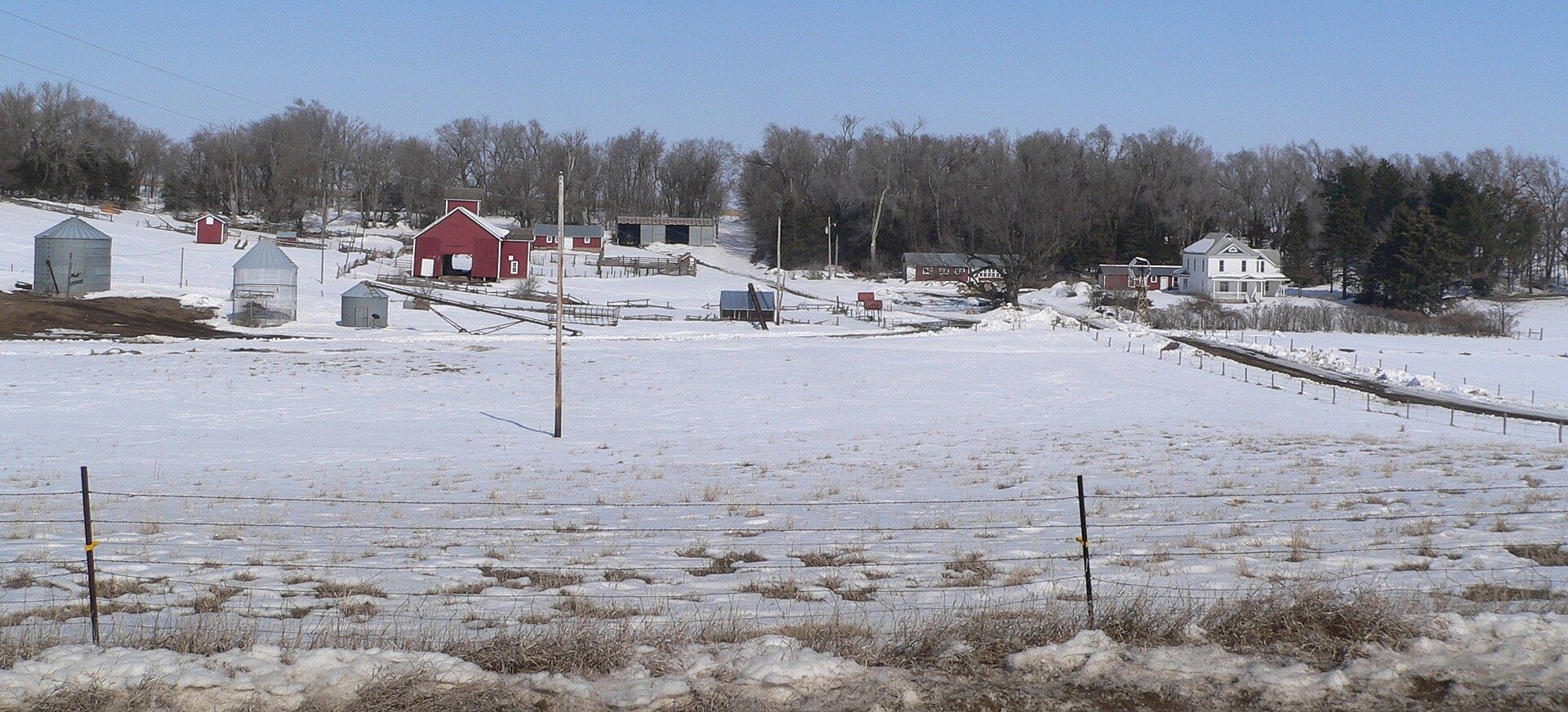 The barns and farmyard of a long held Nebraska family farm. A Wikimedia Commons photograph on Brent O'Mara Insights.