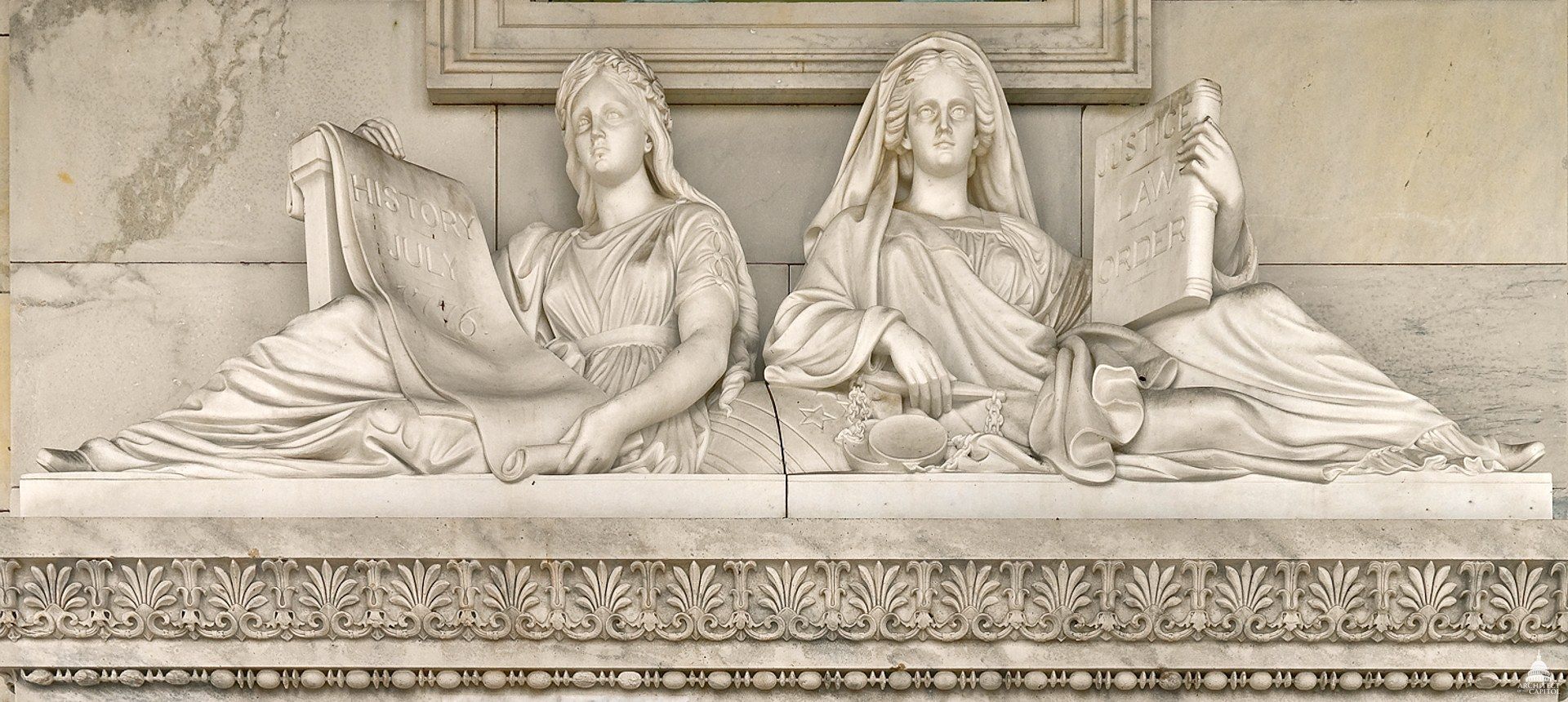 The carved figures of Justice and History above a doorway of the United States Capitol. A Wikimedia Commons photograph on Brent O'Mara Insights.